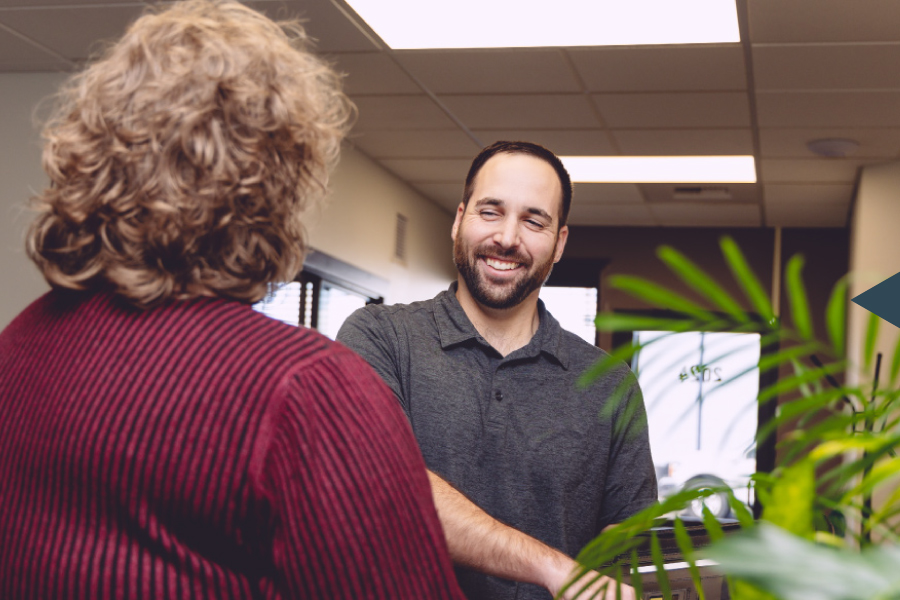 Vemco team members talking in Billings office space